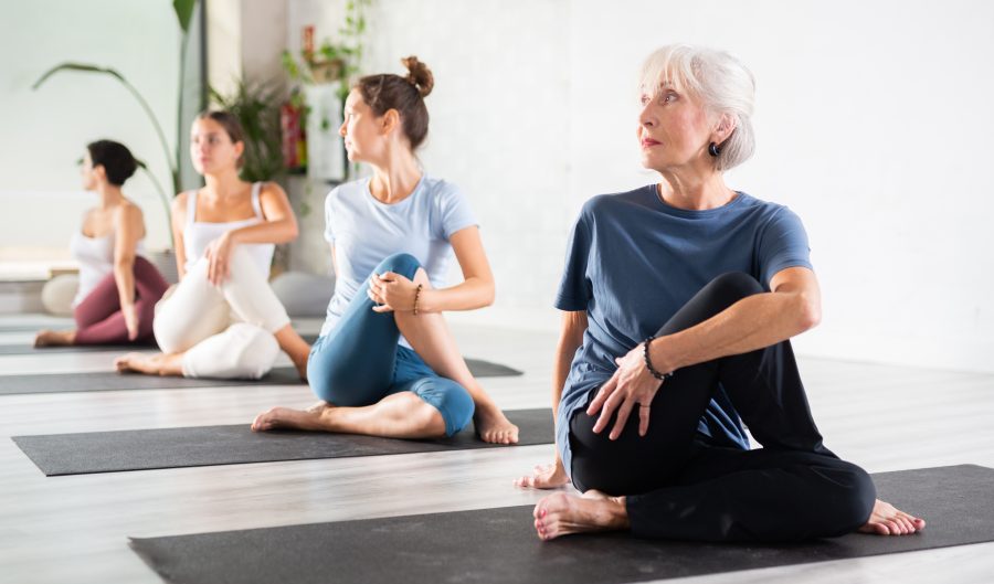 women stretching on yoga mats